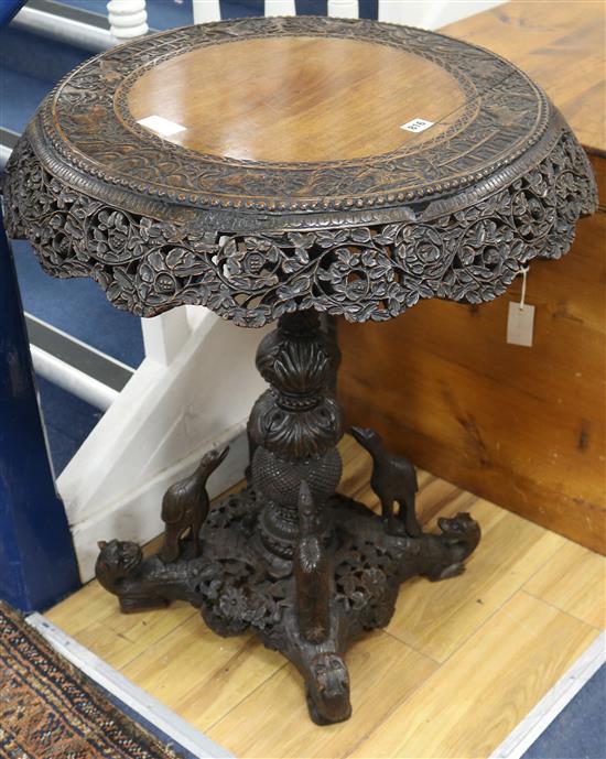 A 19th century Indian carved padouk circular topped tea table, H.75cm